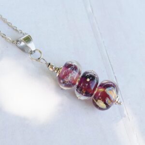 Collier féérique tons prunes et violets